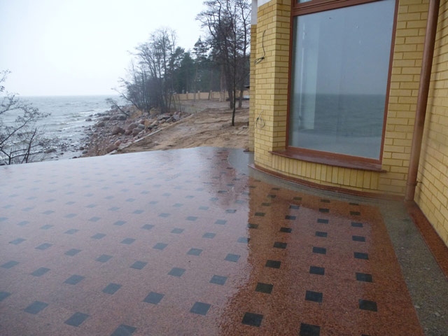 The paving slabs of red granite. Manufacture, sale and installation.