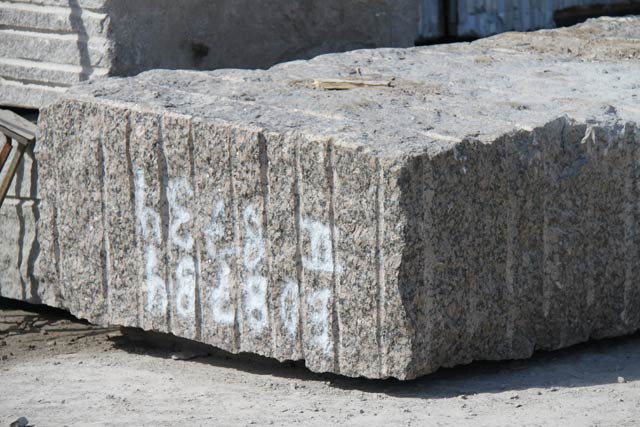 Granite blocks Baltik Brown in a warehouse.  =>Following