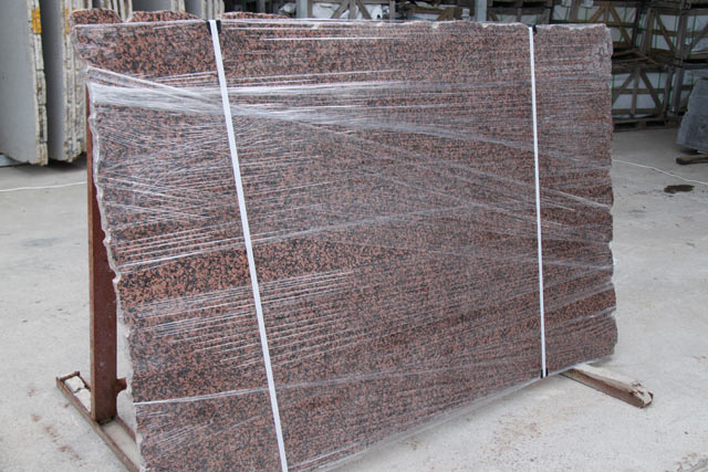 Slabs polished, a granite of Balmoral Red  =>Following