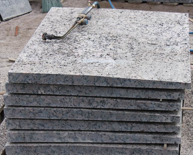 Heat treatment of granite parapets.  =>Following