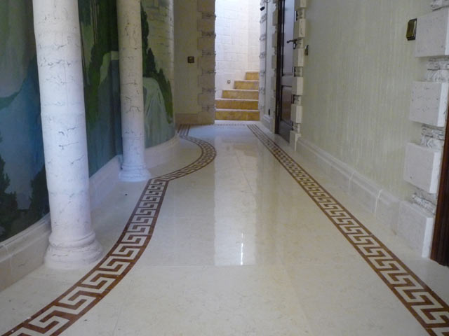 Facing of a floor by marble with application of a decorative meander  =>Following